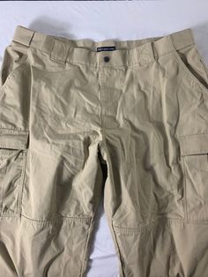 5.11 Tactical Series Capri Pants Size 3x (47.5-51) Material: cotton and polyester Color: tan bag 22r JN Khaki Cargo Pants With Pockets For Camping, Beige Cargo Pants With Side Pockets For Outdoor Activities, Casual Khaki Cargo Pants For Camping, Military Cotton Cargo Bottoms, Summer Capri-length Cargo Pants, Military Style Cotton Cargo Pants For Outdoor, Cotton Capri-length Cargo Pants, Comfortable Cotton Capri-length Bottoms, Tan Bag