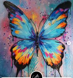 a painting of a blue butterfly with multicolored wings