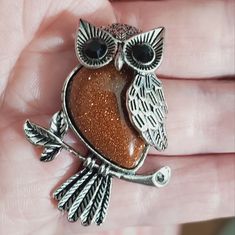 Beautiful Natural Stone. This Owl Is A Brown Amd Its A Sparkly Sandstone, It's Absolutely Beautiful! Hes Sitting On A Branch With Leaves. The Silver Is Not As Dark As Some Of My Photos Look, The Last Several Photos, But It Does Have An Antique Silver Look To It. I Kept The Darker Photos To Show The Color Of The Stone Better, This Is Silver Plated. The Back Has A Bail As Seen In The Photos, It's Large Enough For A Beaded Necklace Chain Or Even A Scarf Could Pull Through The Bail. This Measures 1 Orange Statement Necklace, Branch With Leaves, Chrysoprase Necklace, Blue Crystal Necklace, Silver Link Chain, Silver Choker Necklace, Silver Owl, Wood Bead Necklace, Heart Pendant Gold