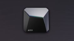 the asus x logo is displayed on a black surface with silver and green accents