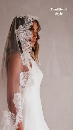 a woman in a wedding dress wearing a veil