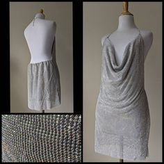 "Stunning Y2K vintage mini dress! Made of metal mesh with tiny set glass crystal aurora boreli stones. Halter top style fitted to adjust for lengths. Backless with elastic at the back waist for a comfortable fit. Side Slits for easy movement. Fully lined in a silver satin like polyester fabric. In excellent condition! Fits a small and up to a medium. Please check measurements to ensure the correct fit. Measurements: Total length: 33\" - 35\" Bust: up to 40\" Waist: 30\" Hips: 39\"" Embellished Fitted Disco Mini Dress, Embellished Fitted Mini Dress For Disco, Fitted Embellished Mini Dress For Disco, Stretch Mini Dress With Rhinestones, Sparkling Fitted Disco Mini Dress, Fitted Sparkling Disco Mini Dress, Embellished Metallic Mini Dress, Fitted Metallic Sparkling Mini Dress, Metallic Sparkling Fitted Mini Dress