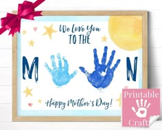 a blue handprinted mother's day card with the words i love you to the moon