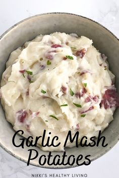 a bowl filled with mashed potatoes and garnished with parsley