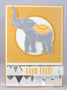 an elephant card with the words good luck written in white and orange on it's side