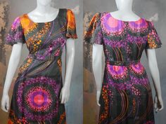 This 1970s mod dress has a stunningly vibrant purple, pink, and orange effervescent abstract polka dot pattern on a black satin sheen background. The dress has a round neckline and short sheer puff sleeves, and a fitted waistline with a matching belt gives way to an A-line drop to the midi-length hemline. The dress is lined in a black satin viscose-nylon fabric, and closes in the back with an 18.5-inch zipper. Bust = 40 inches (101cm) Shoulders = 16.5 inches (41.91cm) Waist = 32 inches (81.28cm) 1970s Fitted Purple Dress, Fitted 1970s Style Purple Dress, Fitted Purple 1970s Style Dress, 1970s Fitted Multicolor Dresses, Multicolor Fitted 1970s Style Dress, Fitted Multicolor 1970s Style Dresses, Fitted Multicolor 1970s Dresses, Midi Length Black Dress, European Dress