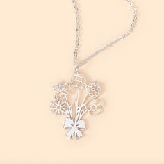 [BIRTH FLOWER BOUQUET]: This necklace features a finely crafted bouquet of birth flowers adorned with an elegant bow, symbolizing each family member's unique beauty and individuality. It’s a wearable piece of art that tells a story, making it the perfect way to celebrate life’s most cherished moments.
[PREMIUM QUALITY]: Each necklace is meticulously crafted from high-quality materials to ensure durability and lasting beauty. The pendant is available in 3 classic colors, providing a luxurious touch that complements any outfit. The intricate detailing of the birth flowers is expertly designed to capture the essence and elegance of nature, making this necklace a timeless addition to any jewelry collection.
[VERSATILE ELEGANCE]: Whether worn with casual or formal wear, it enhances your style a Silver Flower Necklace For Valentine's Day, Silver Flower Necklace With Charm For Birthday Gift, Silver Flower Necklace For Mother's Day Birthday, Silver Flower Necklace For Birthday And Mother's Day, Silver Flower Charm Necklace For Birthday, Silver Flower Pendant Necklace For Birthday, Elegant Flower Necklace For Birthday Gift, Flower Pendant Necklace For Mother's Day Anniversary, Mother's Day Flower Pendant Necklace For Anniversary