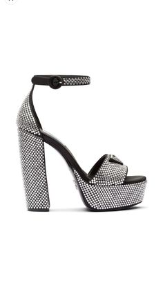 135mm crystal-studded platform sandals from PRADA featuring black, leather, enamel triangle logo, crystal embellishment, high block heel, open toe, buckle-fastening ankle strap, branded leather insole and satin finish. Brand Style ID: 1XP53BF1352AWL SIZE & FIT v Designer Ankle Strap Sandals With Rhinestones, Luxury Crystal Embellished Ankle Strap Sandals, Luxury Ankle Strap Heels With Rhinestones, Designer Sandals With Rhinestones And Open Heel, Designer Rhinestone Sandals With Open Heel, Luxury Evening Sandals With Platform, Luxury Evening Platform Sandals, Evening Sandals With Studded Rubber Outsoles And Open Heel, Luxury High Heel Sandals With Studded Outsoles