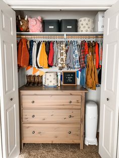 an organized closet with clothes and other items