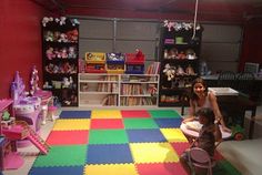 a child's playroom with toys and children's furniture