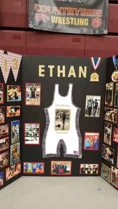 a display with photos and pictures on it in a gym area, showing the names of athletes