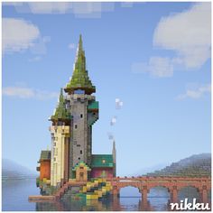 an image of a castle in the middle of water with a bridge going across it