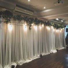 the curtains are covered with vines and lights