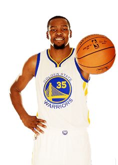 a man holding a basketball in his right hand and wearing a white uniform with the golden state warriors on it