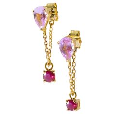 Earrings can complete any outfit with glamour and style. These sparkly earrings have us buzzing! Inspired by a fun love of color, these glimmering earrings will surely put a smile on any dreary day. The sweetest pink sapphires are paired with vivacious red Ruby combine in this unforgettable pair. 1 carat pink sapphires and .30 carat rubies total. These beauties are one of our signature chain earrings. They are gorgeous worn alone or stacked with any one of our hoops or studs for an amazing earring stack. Hand forged in 18k yellow gold with hand-selected gemstones. Ruby Chain, Earring Stack, Fun Love, Sparkly Earrings, Red Ruby, Chain Earrings, Girls Best Friend, 1 Carat, Hand Forged