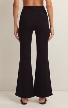 We love a good flare pant and the Do It All Flare Pant has it all! This chic high rise pant features a slim fit throughout the hips, a kick flare, and our fave detail; the supportive feel from the durable, stretchy fabric. Z SUPPLY Women's Do It All Flare Pant, Black, Extra Small Mid-rise Black Yoga Pants For Work, Black Flare Bottoms For Loungewear, Chic Flare Bottoms For Loungewear, Black Flare Loungewear Pants, Black Stretch Flare Jeans For Work, Chic Flare Pants For Loungewear, Sleek Flare Bottoms For Night Out, Trendy Flare Bottoms For Workwear, Chic Flare Yoga Pants