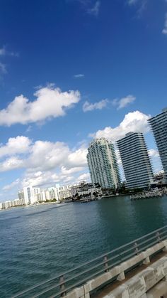 some buildings are next to the water and blue sky