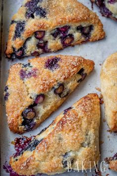 blueberry turnover pies on a baking sheet