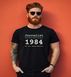 A 40th Birthday t-shirt for journalists, writers, or editors who are turning 40 in 2024. Short-sleeve, crew-neck T-shirt with slogan: Journalist - est. 1984 - And still making headlines Choice of 4 great colors - Black, Dark Grey Heather, Natural, and Soft Pink. Lettering is in pale natural on the dark t-shirts and a very dark purple-black on the light t-shirts. Available in 5 sizes from S-2XL (see photo for sizing info). T-shirts are 100% cotton, except for the Dark Grey Heather which is a marl fabric and made from 52% cotton and 48% polyester. Manufactured in the USA using eco-friendly methods. The T-shirt will be specially made for you - so delivery times are a bit longer than usual and items are non-returnable, unless faulty. The listing is for the T-shirt only - no other items in the