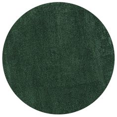 a round rug in dark green color on a white background with room for text or image