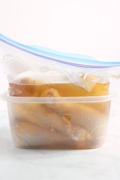 a plastic container filled with food sitting on top of a counter