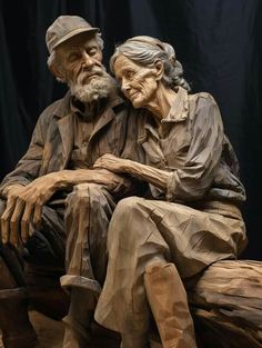 an old man and woman sitting next to each other on top of a wooden bench