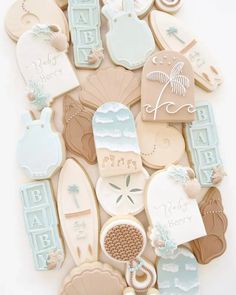 some cookies are laying on top of each other and decorated with different types of items