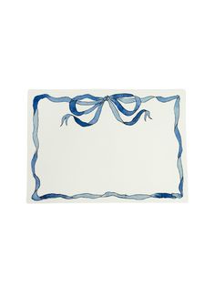 a blue and white place mat with a bow on it's edge, in the shape of a rectangle