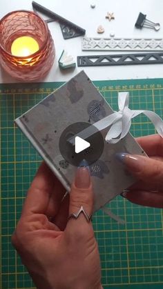 someone is making a card with scissors and tape