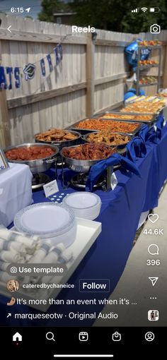 an image of a buffet table with food and drinks on the table in front of it