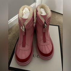 Brand New In Box. 100%Authentic. Gucci Kids Rain Boots In Pink And Red Size 33 Rain Boots From Gucci Kids. Made Of Leather. Zip Fastening. Trimmed With Beige Fur. Decorated With Gold-Tone Logo Print. Rubber Sole. Warm And Comfortable~~ Gucci Winter Boots With Round Toe, Designer Pink Boots With Round Toe, Designer Pink Round Toe Boots, Gucci Designer Boots With Round Toe, Baby Rain Boots, Girls Rain Boots, Toddler Rain Boots, Gucci Baby, Kids Rain Boots