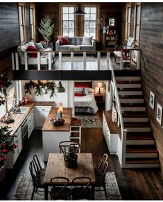 an open floor plan with stairs leading up to the loft