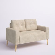 a white couch sitting on top of a wooden frame