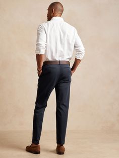 A sophisticated spin on our best-selling chinos, this tapered cotton pant has a pleated front and soft center crease at back so it's simple to fold and looks tailored when worn.  ATHLETIC TAPERED FIT: Not just for athletes, this fit is designed to de Cotton Pants, Chinos Pants, Banana Republic, Slim Fit, Navy, Pants, Trousers