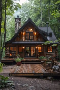 a cabin in the woods is lit up at night