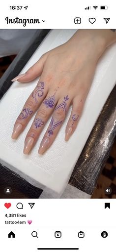 a woman's hand with tattoos on it and the words instagram written in purple ink