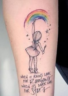 a person with a rainbow tattoo on their arm and the words when it rains live, there is always a dark line for stars