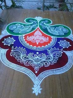 a colorful rangdi design on the ground