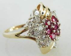 Here is a wonderful 14K gold diamond and ruby ring. This ring has incredible shine and eye appeal. The combination of the gold along with the stones really make this ring stand out. This is the perfect ring for someone who wants a timeless, vintage piece. Ring: 14K Gold Stones: 1.60 carats of Diamonds, Rubies Size: 8 Marked: 14K Weight: 9.4 grams SKU#20CB81917 If you have any questions on this item, please message us! GandDJewelers.etsy.com For ring sizing, please contact us for information. Ple Formal Ruby Ring With Diamond Accents In Cluster Shape, Formal Cluster Ruby Ring With Diamond Accents, Red Cluster Diamond Ring In 14k Gold, Red Diamond Cluster Ring In 14k Gold, Anniversary Red Cluster Ring Stamped 14k, Multi-stone Ruby Cluster Diamond Ring, Classic Red Multi-stone Cluster Ring, Formal Red Cluster Ring With Diamond Accents, Cluster Ruby Ring Stamped 14k For Wedding