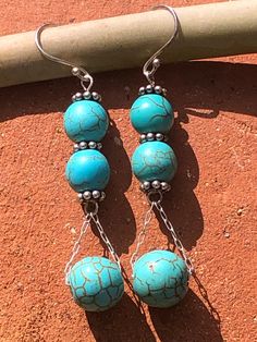 Southwestern Style, Beautiful Turquoise, round, stone beads, 7 mm and 11 mm. 925 Sterling Silver Ear Hooks,  925 Sterling Silver decorative Rondelle spacer beads. 925 Sterling Silver chain and earring stems. Sterling Silver Gemstone Bead Earrings, Silver Beaded Earrings With Natural Stones, Sterling Silver Earrings With Round Gemstone Beads, Silver Earrings With Gemstone Round Beads, Silver Earrings With Gemstone Beads, Adjustable Turquoise Earrings With Spacer Beads, Turquoise Dangling Beads Sterling Silver Earrings, Turquoise Jewelry With Dangling Round Beads, Turquoise Sterling Silver Earrings With Dangling Beads