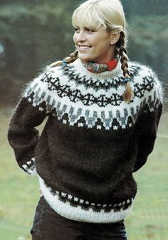 a woman with braids wearing a black and white sweater