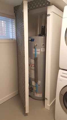 a water heater and washer in a small room