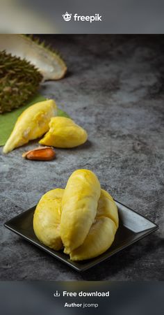 there are two pieces of fruit on the plate and one is sliced into small pieces