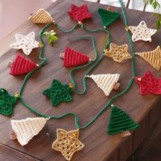 crocheted christmas ornaments are arranged on a table