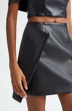 An asymmetric faux-wrap detail lends contemporary drama to this sleek faux-leather miniskirt that's sure to turn heads. 16 1/2" length (size 2) Pull-on style Lined 100% polyurethane Dry clean Imported Black Owned/Founded Leather Miniskirt, Fabric Gift Bags, Leather Mini Skirts, Nordstrom Store, Fabric Gifts, Free Fabric, Anniversary Sale, Black Fits, Size 2