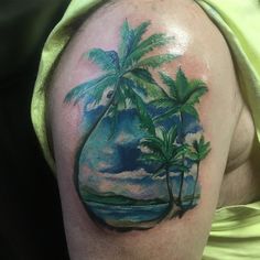 a man with a palm tree tattoo on his arm