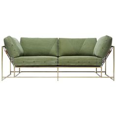 a green couch sitting on top of a metal frame