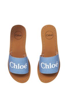 Slip-ons; Round tip Denim upper Contrast printed logo on the front Flat brown rubber sole Leather lining Blue color Upper 100% Fabric; 100% Rubber sole; Interior 100% leather Made in India | Chloé Baby Girl's Sandals in Brown | SS24 Chloe Sandals, Chloe Kids, Feminine Chic, Brown Flats, Kenzo Kids, French Chic, Girls Sandals, Kids Sandals