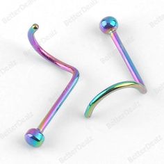 two rainbow colored metal nose piercings with long curved bar ends on each end, one is