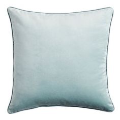 a light blue pillow on a white background